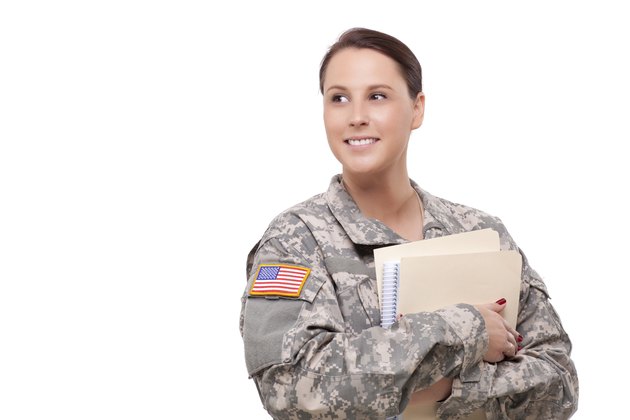 Female soldier with folder looking away
