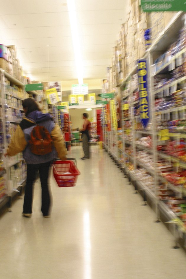 A typical Melbourne Supermarket. A shopper awaits their groceries to be put through the checkout. 2003