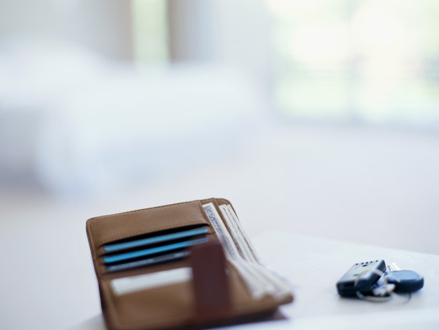 close-up of a wallet and car keys