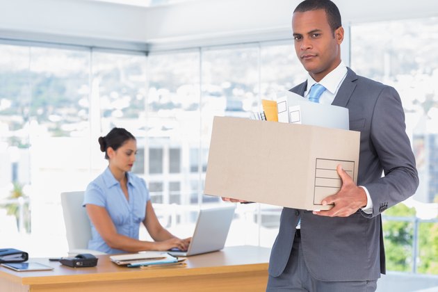 Unhappy businessman leaving the company