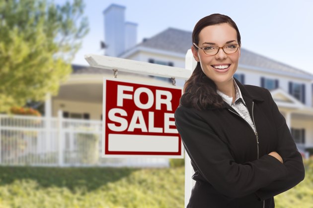 Young Woman in Front of House and Sale Sign