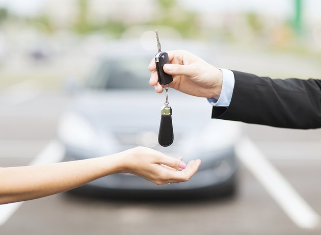 customer and salesman with car key