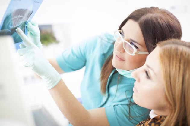 Young woman patient and dentist