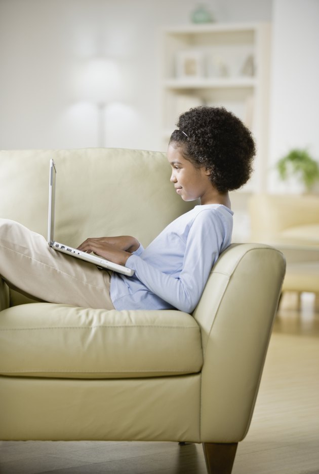 Woman typing on laptop