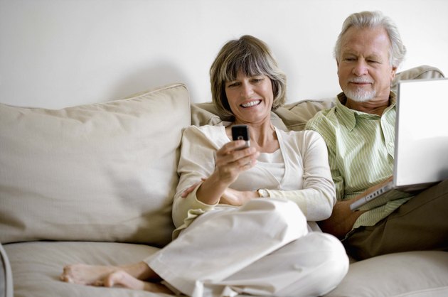 Couple with a laptop and cell phone