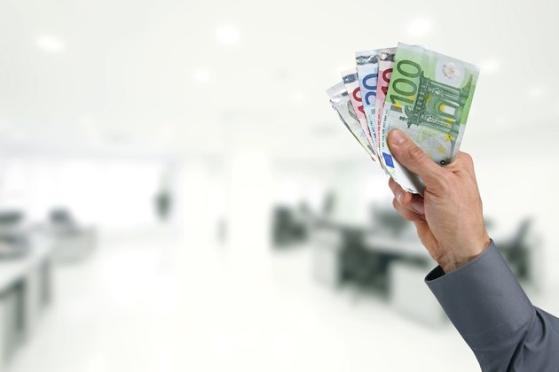 businessman hand with euro money