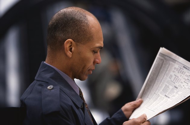 Man Reading the Newspaper Financial Page