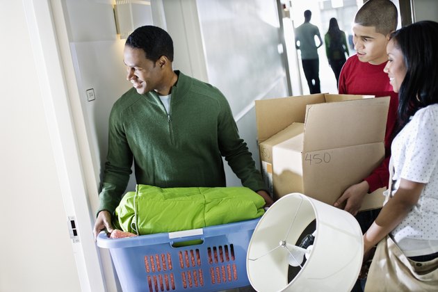 Father Helping Daughter Move into Dormitory