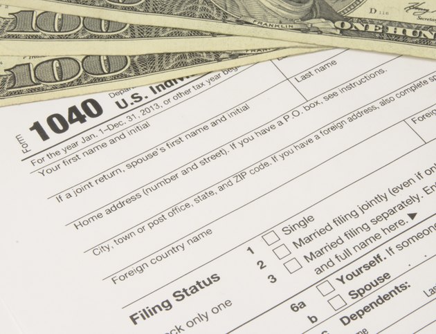 IRS Tax Form 1040 with Money