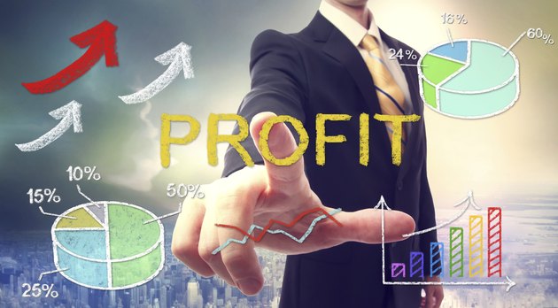 Business man pointing PROFIT