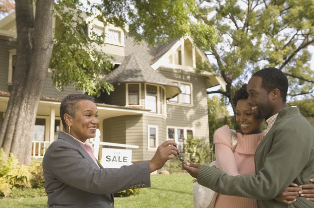 Man and woman with new house