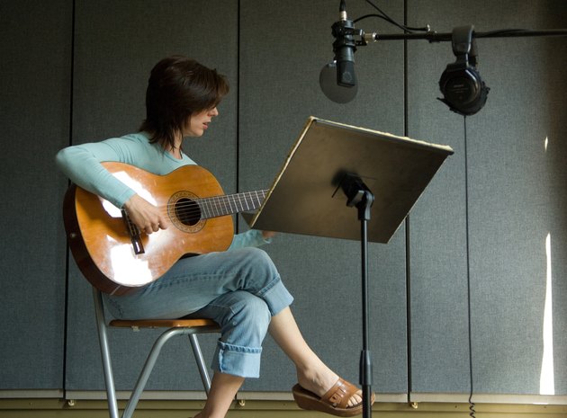 Guitarist in recording studio