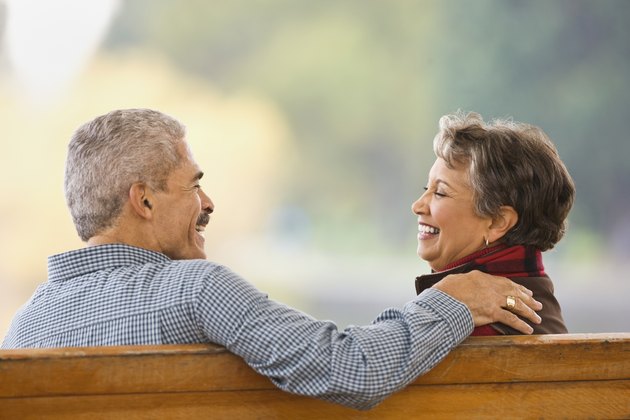 African couple sitting on bench
