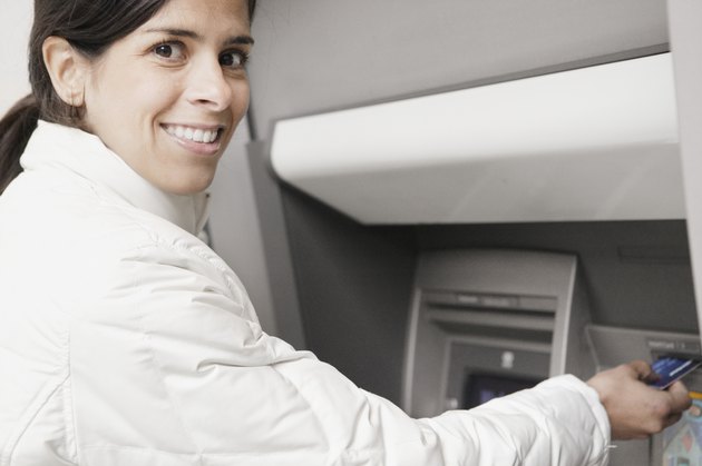 Young woman using an ATM
