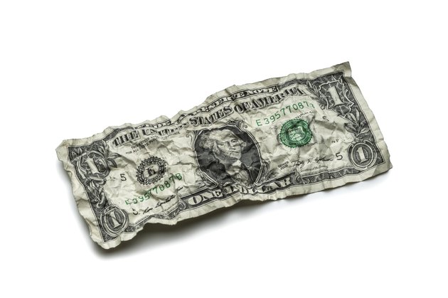 Crumpled dollar bills isolated on white background