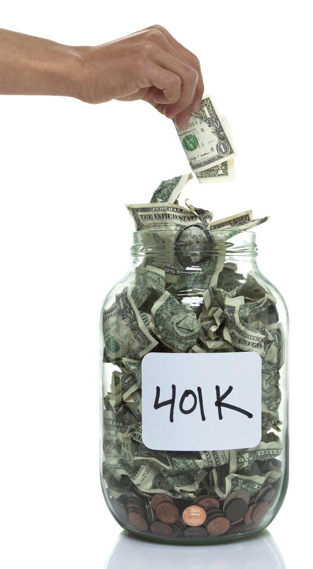Hand putting money into savings jar with white 401k label