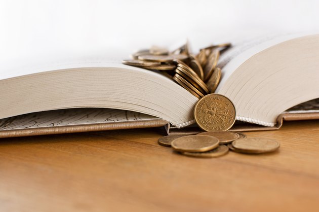 Open book with copper coins