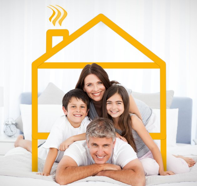 Smiling family portrait in bed