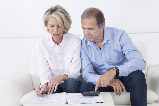 Couple doing family finances at home