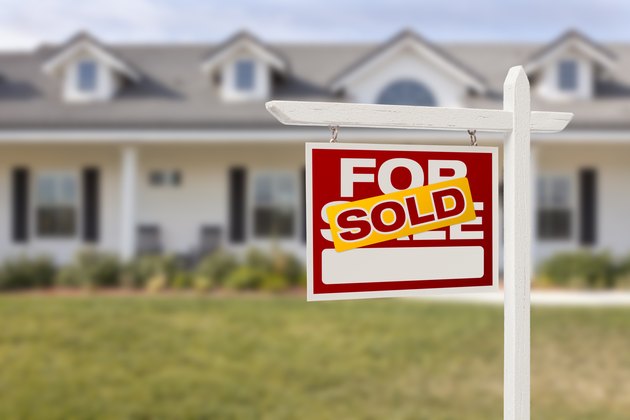 Red Sold For Sale Real Estate Sign and House