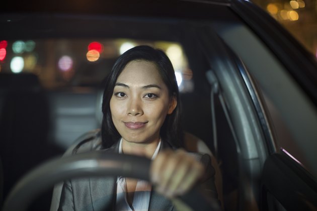 Businesswoman Driving Car