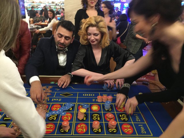 Gamblers at a roulette table