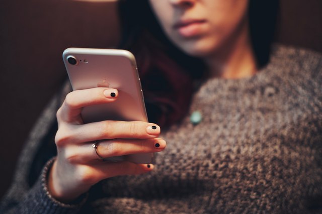 Millennial young woman using mobile phone