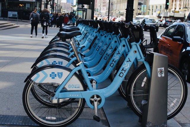 Receding rows of rentable blue bicycles in Chicago