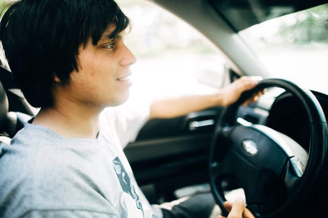 Young man driving a car