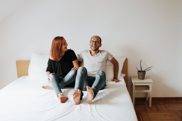Young couple in undecorated bedroom