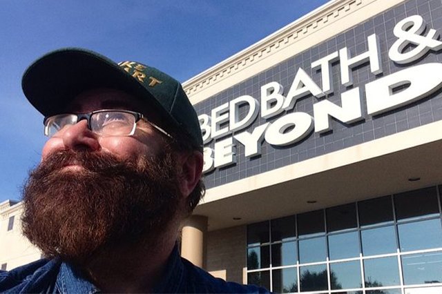 Mike Mozart poses in front of Bed Bath & Beyond storefront