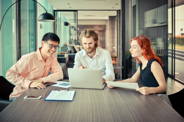 Group of business people meeting in a meeting room, sharing their ideas, Multiethnic