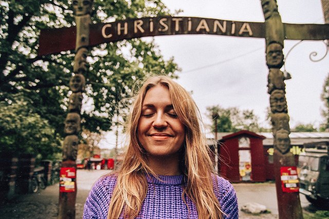 Woman posing in front of Danish tourist trap