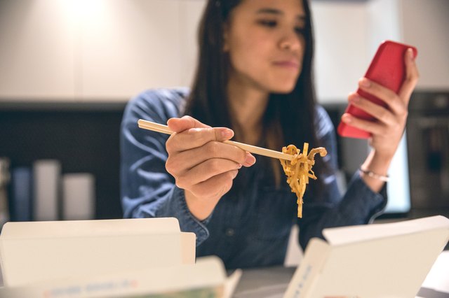 Woman eating at home food ordered online