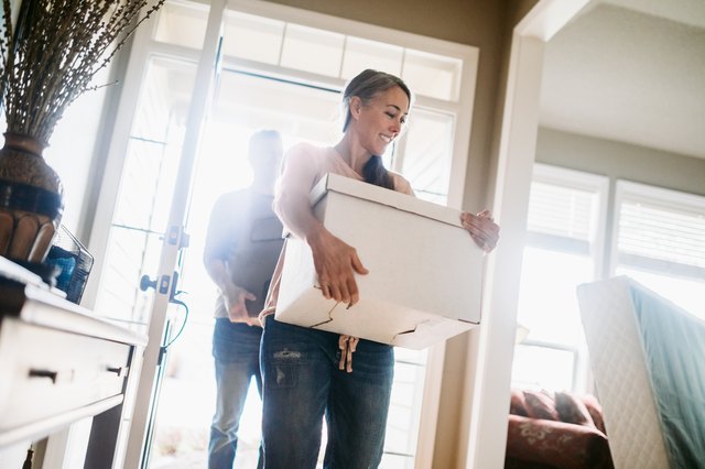 Mature Couple with Moving Boxes in New Home