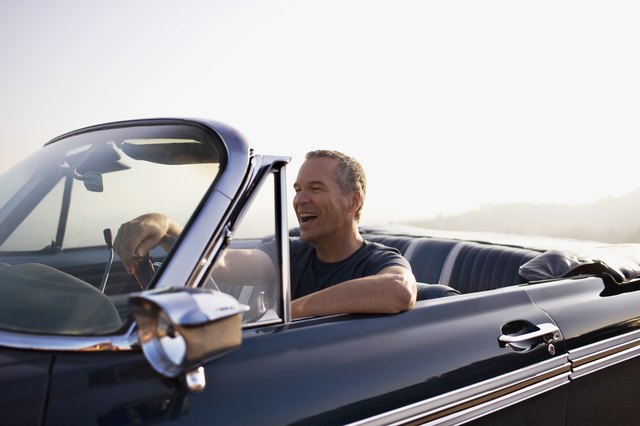 Man driving convertible