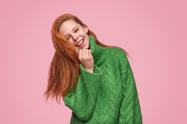 Adorable happy woman in stylish sweater