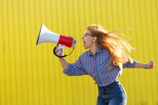 Girl activist shouts in loudspeaker