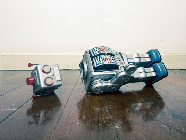 vintage bot lost his head on a old wooden floor