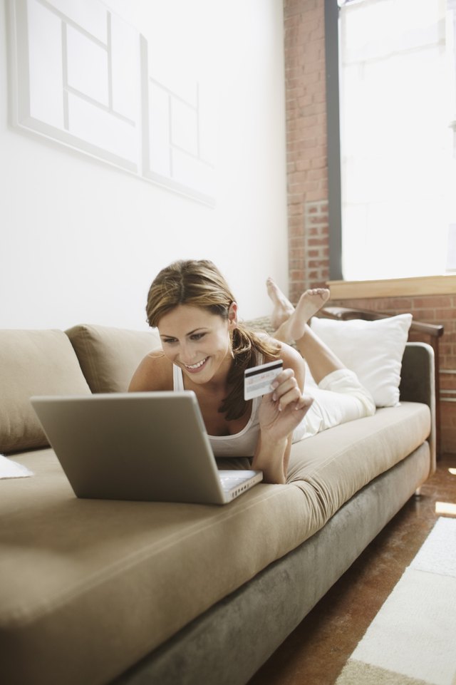 Young adult woman using laptop computer