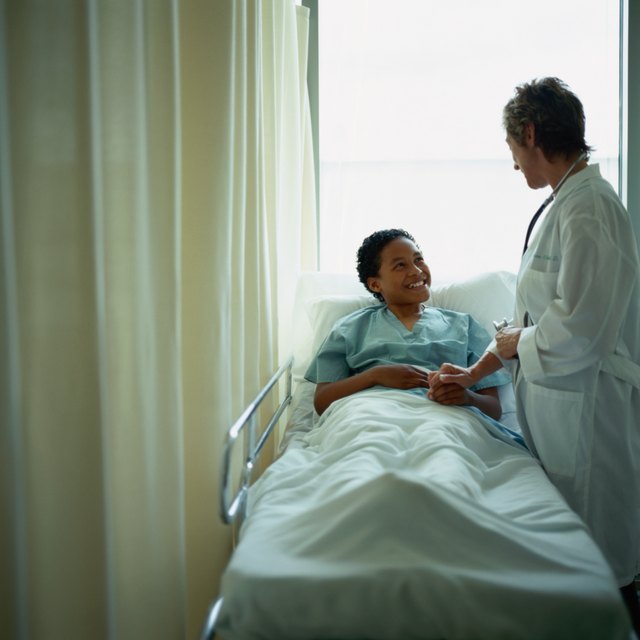 Doctor Comforting Child Patient in Hospital