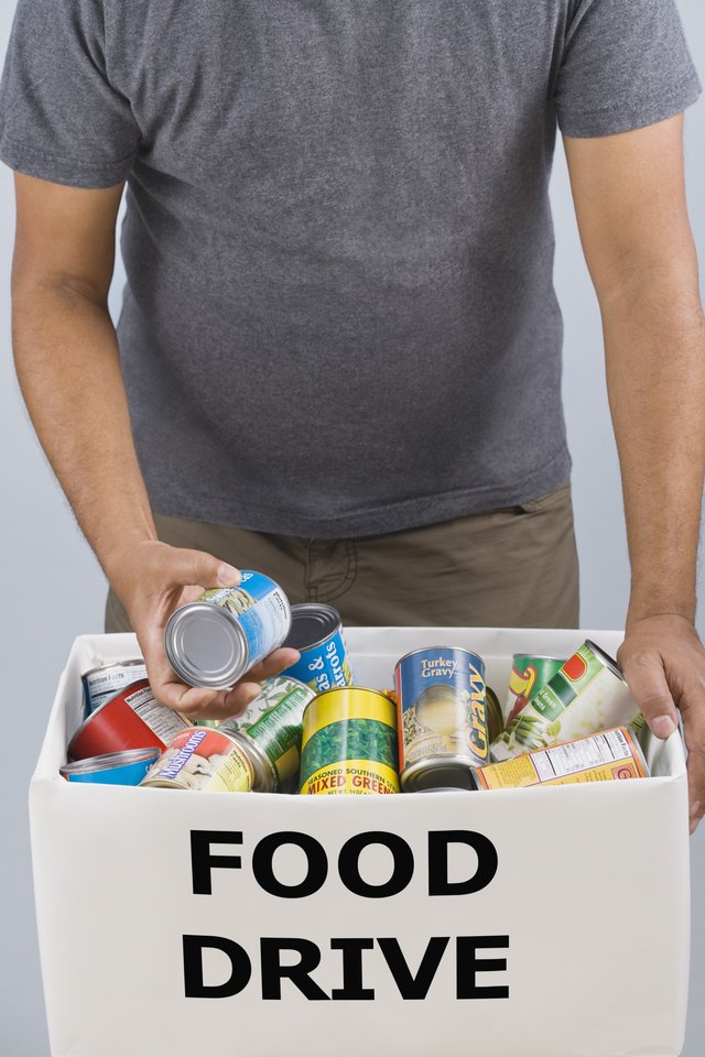 Man holding food drive box