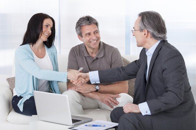 Consultant Shaking Hand With Woman