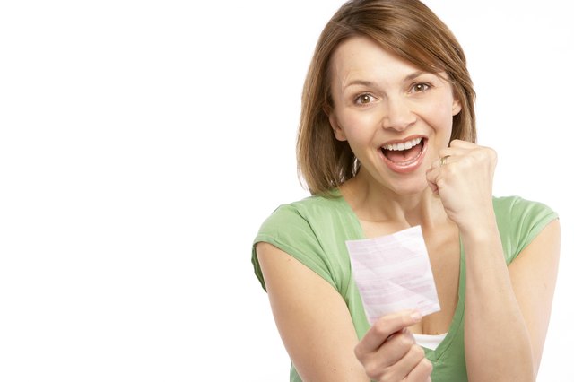 Woman with lottery ticket