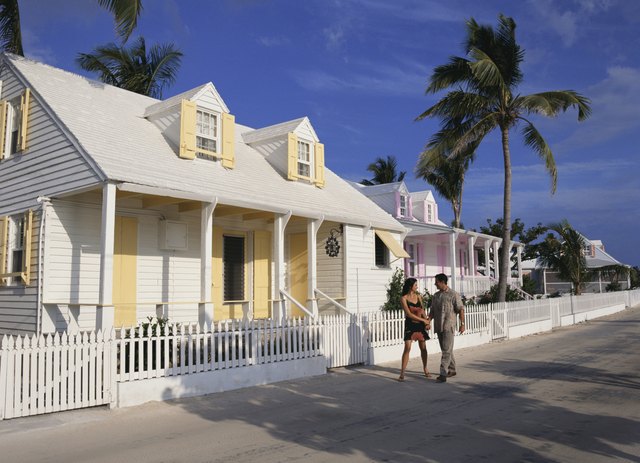 Couple walking by house