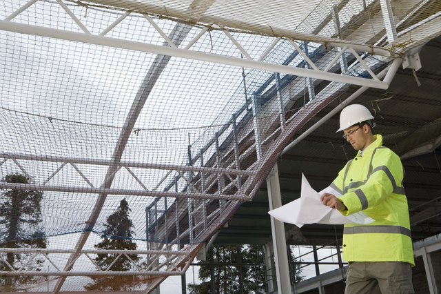 Engineer with blueprints