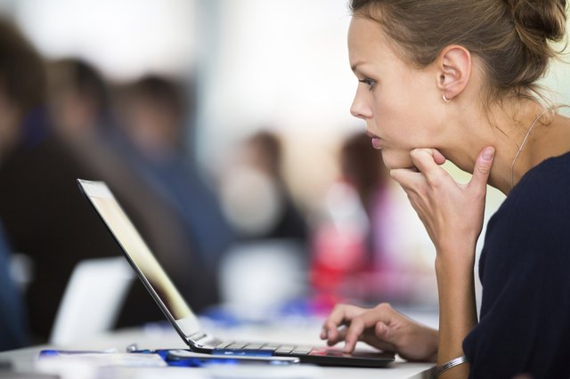 Business woman using laptop computer