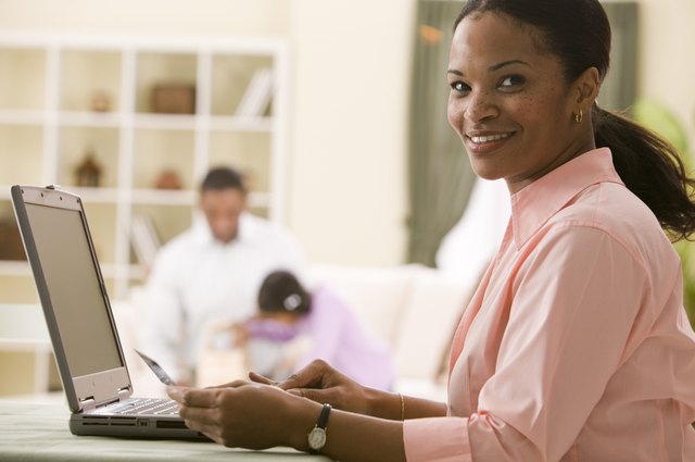 Woman making online purchase with credit card