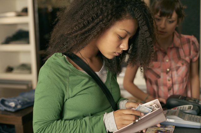 Teenage girl at cash register