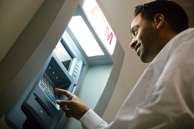 Man using ATM